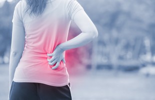 woman waist injury in park
